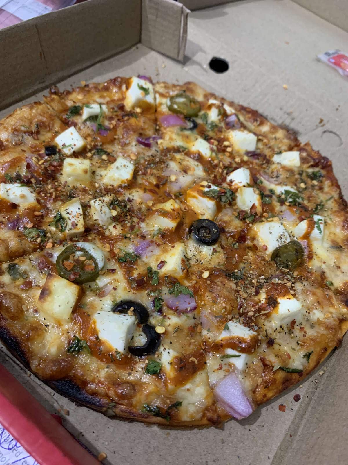 Paneer pizza packed for delivery